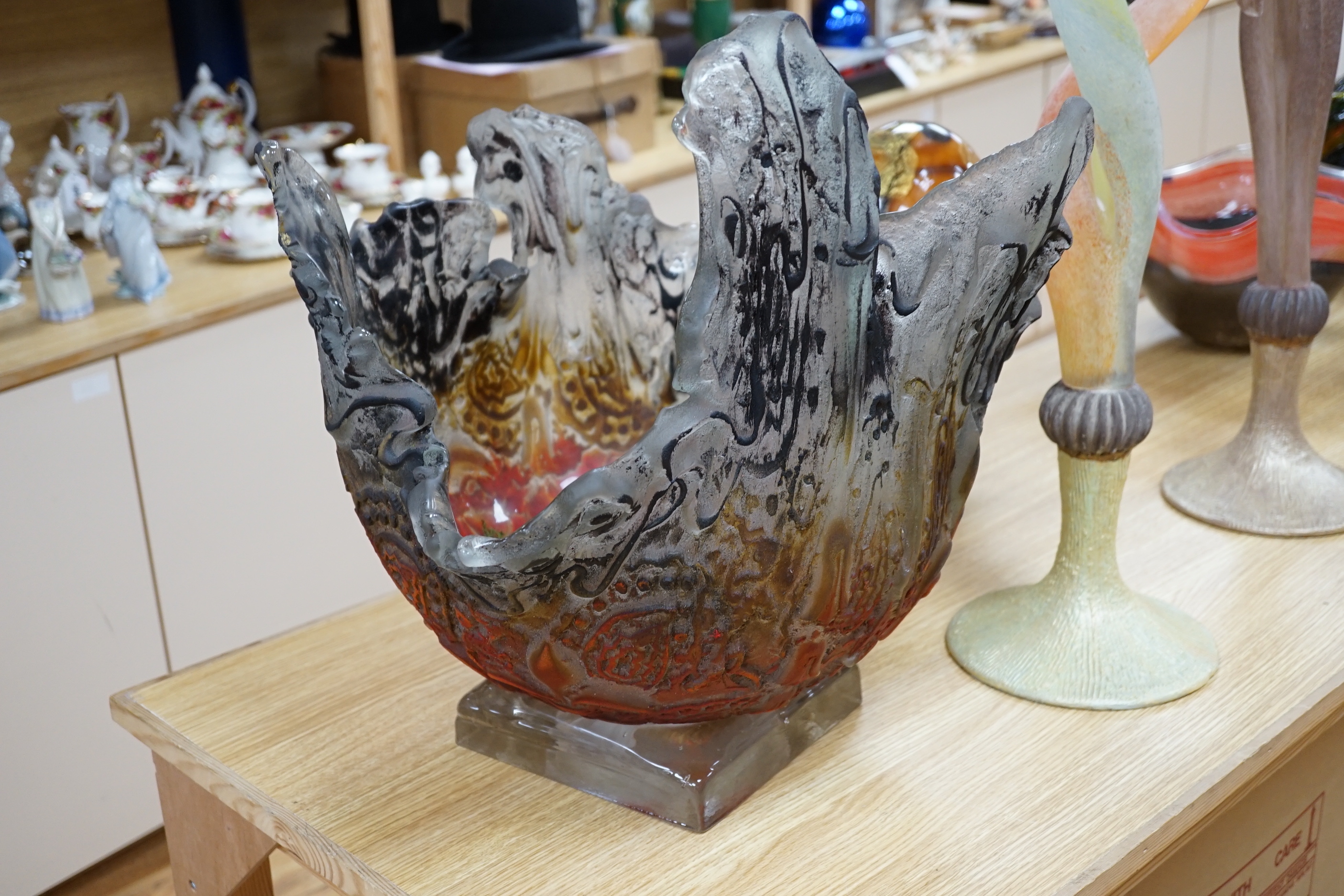 A large art glass textured centrepiece on stand, with amber orange and black matt over glazing 49 cm high